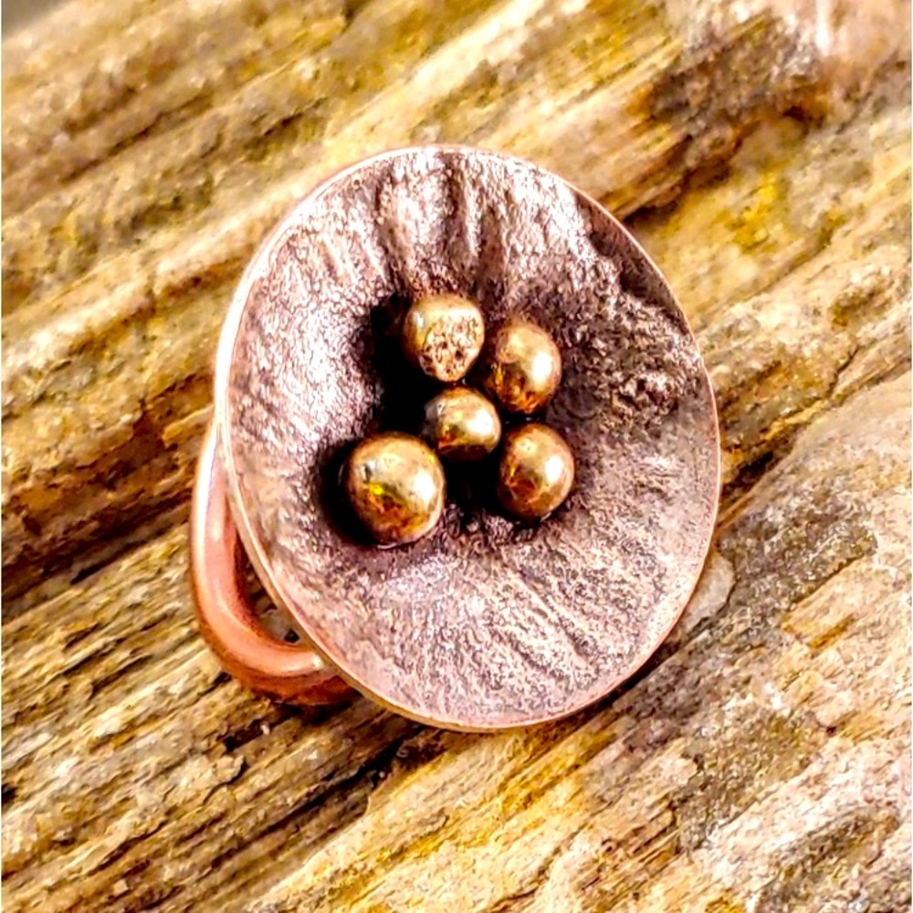 Brass beaded copper concave saucer ring w/ reticulated textured silver.